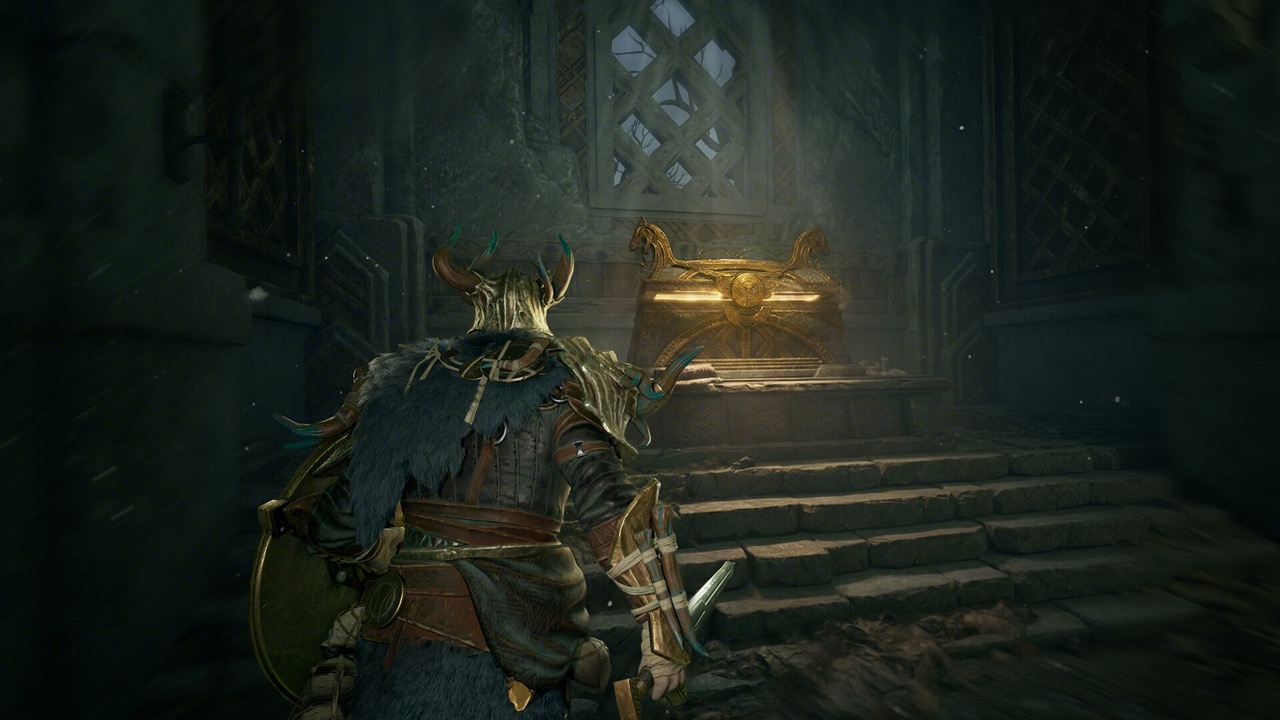 Stone chamber with a glowing golden chest up a short stair
